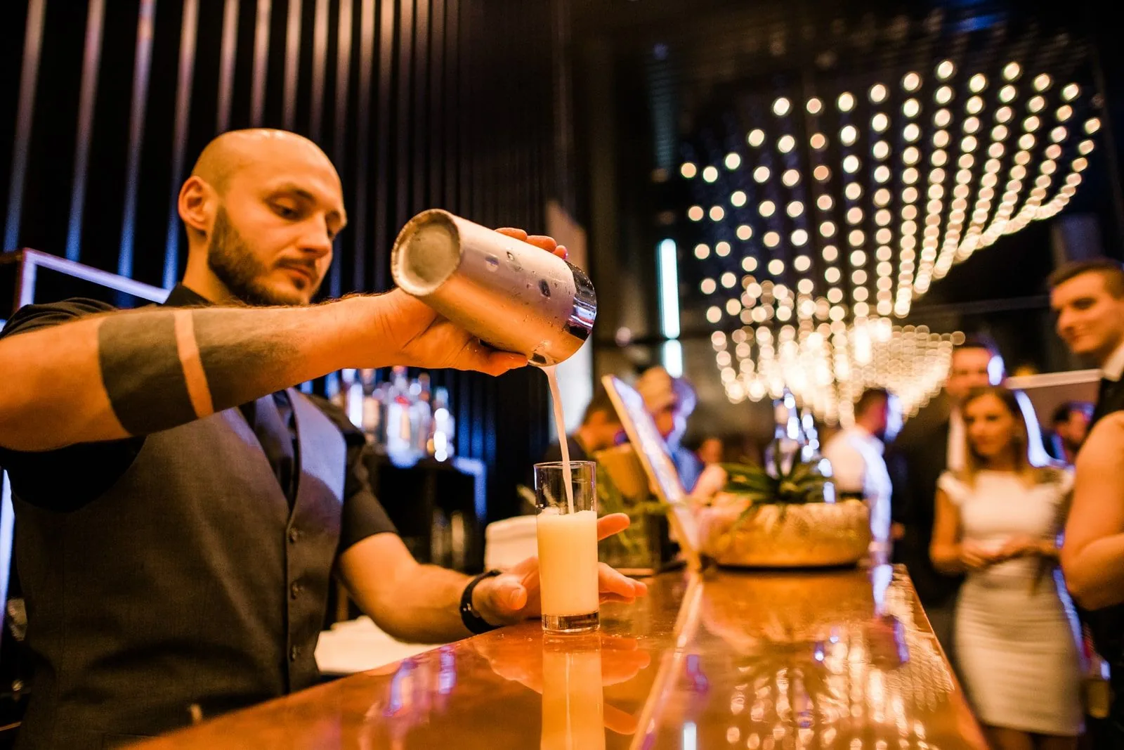 Bartender preparing drinks for event guests