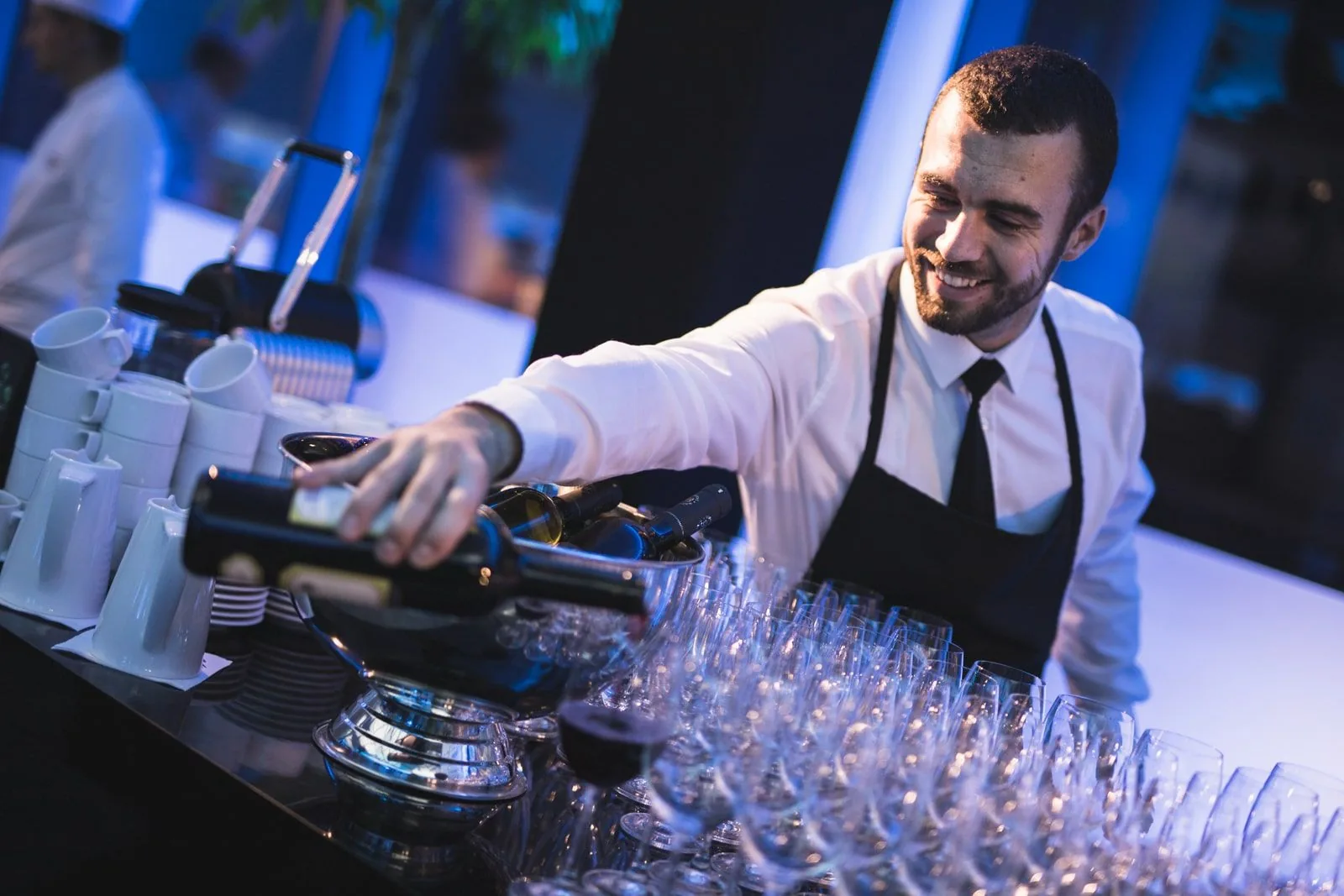 Bartender preparing glassware before guests arrive