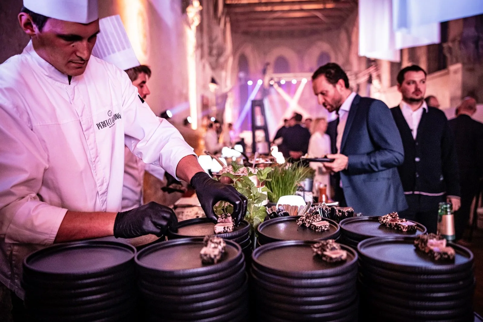 Perfect Catering team serving guests at a live cooking station