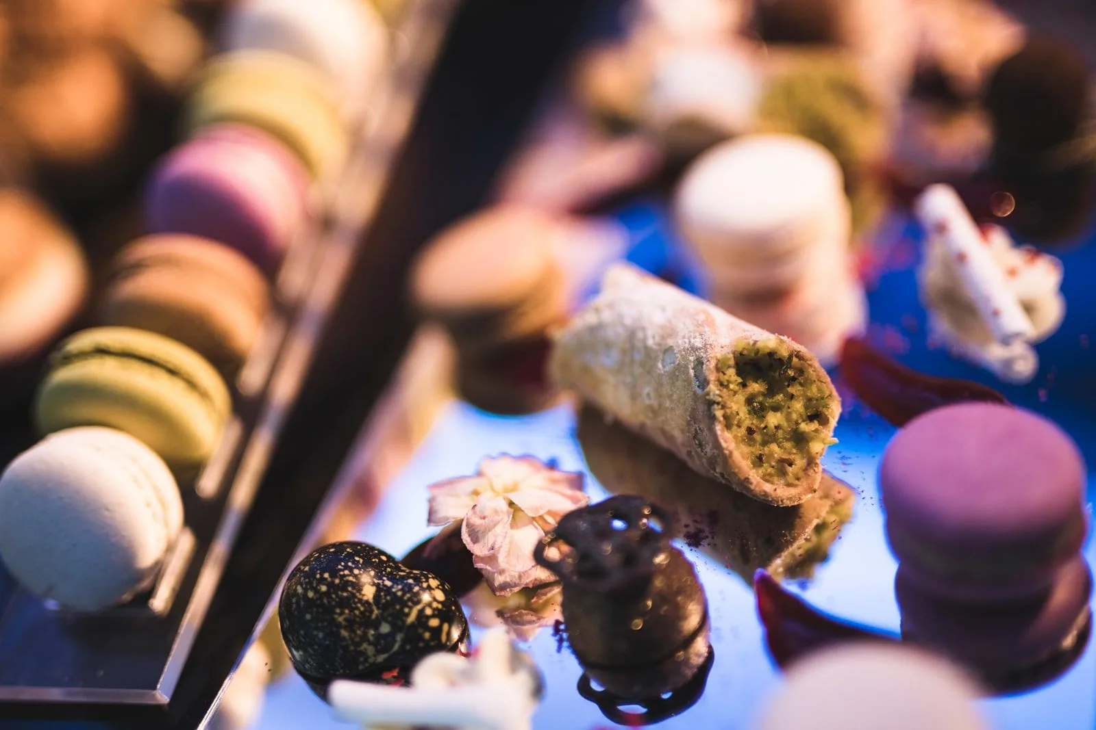 Detail of desserts and macarons from a catering menu